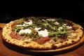 Neapolitan pizza (Naples pizza) with buffalo mozzarella cheese, parma ham decorated with fresh arugula. Royalty Free Stock Photo