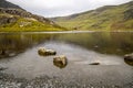 Llyn Cwmorthin with the ruin of Cwmorthin Terrace, the Compressor House and