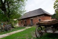 Near the house there are carts for transporting goods and people, with the help of horses. Royalty Free Stock Photo