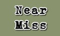 Near Miss - Flat Torn Paper Words on Green Background Royalty Free Stock Photo