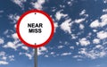 Near miss traffic sign on blue sky Royalty Free Stock Photo