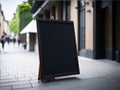 Near the restaurant\'s entrance, there may be a blank restaurant shop sign or menu board.