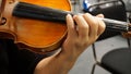 Women practicing violin, hands closeup
