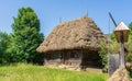 Home with straw roof in a traditional village at Sighet