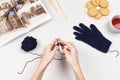 Woman hands knit glove with bamboo spokes from blue wool yarn. Royalty Free Stock Photo