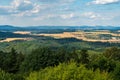 Nearer Duba town, Ceska Lipa city and Luzicke hory mountains on the background ftom Nedvezi hill summit in Ralska pahorkatina Royalty Free Stock Photo