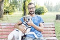 Nearsighted man with his dog wearing glasses Royalty Free Stock Photo