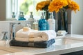 A neat arrangement of towels and soap displayed on a sink inside a bathroom Royalty Free Stock Photo