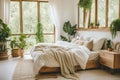 a neat bedroom with natural light and green plants Royalty Free Stock Photo