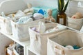 neat fabric storage baskets in a nursery with baby items