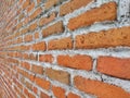 Neat and orderly pattern of red brick and cement arrangement on the walls of the house Royalty Free Stock Photo