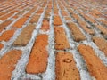 Neat and orderly pattern of red brick and cement arrangement on the walls of the house Royalty Free Stock Photo