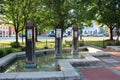 Pretty fountain in the common with tall pillars and brick walkway, Hamilton, New York, 2019