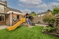 Neat patio with sitting area with playground
