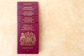 Neat pile of five British United Kingdom European Union Biometric passports with copyspace for text