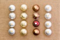 Neat rows of Christmas ornaments on burlap