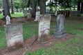 Neat rows of large headstones honoring residents under shady trees, Oakwood Cemetery, Chittenango, New York, 2018