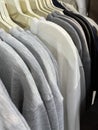 Neat rows of t-shirts with hangers