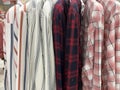 Neat rows of t-shirts with hangers Royalty Free Stock Photo