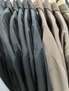 Neat rows of t-shirts with hangers Royalty Free Stock Photo