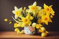 Neat small bouquet of golden daffodil flower in pot on wooden table