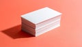 Stack of Blank White Business Cards on Coral Background Royalty Free Stock Photo