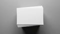 A neat stack of blank white papers is arranged on a smooth, gray surface Royalty Free Stock Photo