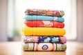 neat stack of colorful yoga bolsters