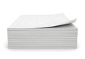A neat stack of crisp white paper sheets with one sheet curled upward Royalty Free Stock Photo