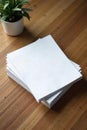 Neat stack of crisp white printer paper on wood, clean, new Royalty Free Stock Photo