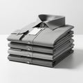 Stack of Folded Grey Men\'s Dress Shirts with Tags on a White Surface clothing apparel Royalty Free Stock Photo