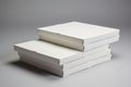 Stack of blank white pizza boxes on neutral background Royalty Free Stock Photo