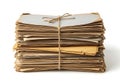 A neat stack of vintage yellowed papers and aged documents tied together with rustic twine isolated on a clean white background Royalty Free Stock Photo
