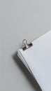 Neat stack of white papers with silver clip on gray background Royalty Free Stock Photo