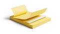 Stack of Yellow Sticky Notes With Top Sheet Peeled Back on White Background Royalty Free Stock Photo