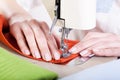 Neat tailor sewing a fabric Royalty Free Stock Photo