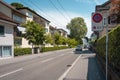 Neat, tidy street with bushes and hedges. European city design.