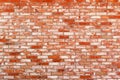 Neat wall of old, reuse red ceramic brick. Grunge background, texture Royalty Free Stock Photo