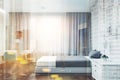 Neat white hotel suite, bed and table, woman blur