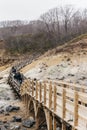 Neat wooden walk way at Noboribetsu Jigokudani Hell Valley: The volcano valley got its name from the sulfuric smell. Royalty Free Stock Photo