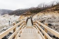 Neat wooden walk way at Noboribetsu Jigokudani Hell Valley: The volcano valley got its name from the sulfuric smell. Royalty Free Stock Photo