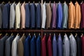 neatly arranged business suits on store racks Royalty Free Stock Photo
