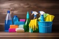 Neatly Arranged Cleaning Tools and Equipment on Wooden Table - Household Chores and Tidying Up Concept