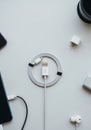 A neatly arranged collection of tech accessories on a white surface. A coiled USB Royalty Free Stock Photo