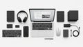 Of tech gadgets on a white background features a laptop with an open screen Royalty Free Stock Photo