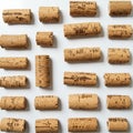 A neatly arranged collection of wine corks on a white background. The corks are evenl Royalty Free Stock Photo