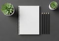 A neatly arranged desk setup features a spiral-bound notebook Royalty Free Stock Photo