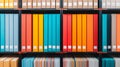 Vibrant Organization: A Colorful Display of Binders and Boxes for Efficient Storage Solutions