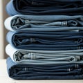 A neatly arranged stack of folded denim jeans in varying shades of blue, ranging from Royalty Free Stock Photo