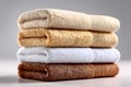 A neatly arranged stack of folded towels placed against an isolated white background Royalty Free Stock Photo